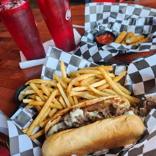 Cheese steak, fries, cheese Stix and tea.