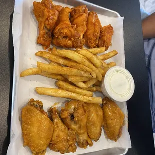 Lemon pepper wings  and mango habanero Sides of Flavor Sauces with the best blue cheese