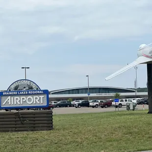 an airplane flying over the sign
