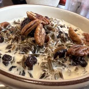 Manoomin Porridge:  wild rice, cream, cranberries, pecans with a touch of maple syrup.  Served hot.  Extremely excellent!!