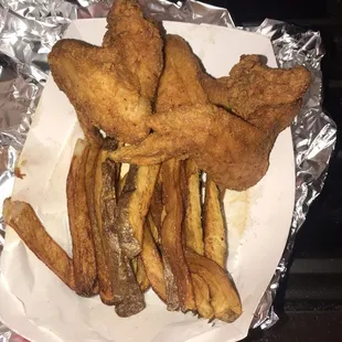 Frat chicken wings with fresh cut french fries and fish with macaroni and cheese and Fresh Yams