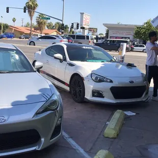 two cars parked in a parking lot