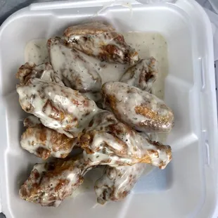 Garlic Parmesan Ranch and INSANE hot wings. Extra crispy as requested. In and out under 10 minutes.  Great flavor, worth the distance.