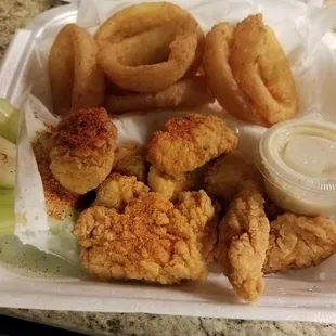 10 naked boneless wings with one side of onion rings.