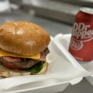 a burger and a can of dr pepper