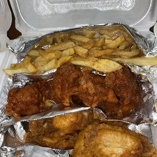 chicken and french fries in foil