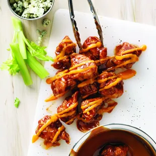 a bowl of sauce and celery