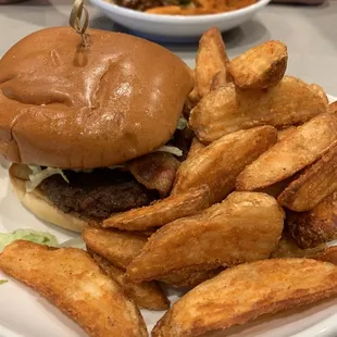 Black and blue burger with potato wedges
