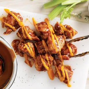 a bowl of sauce and celery