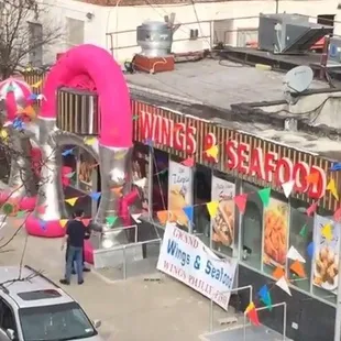 a woman standing in front of a restaurant