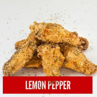 a pile of lemon pepper chicken wings