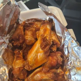 chicken wings wrapped in tin foil