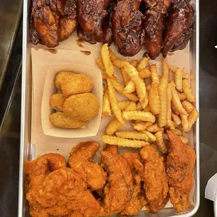 Two different tenders, fries, jalapeño poppers