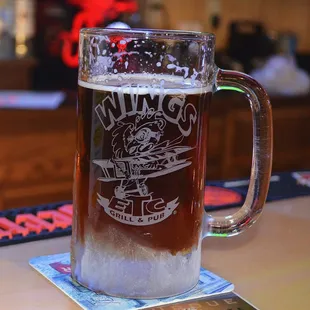 a glass of beer on a table