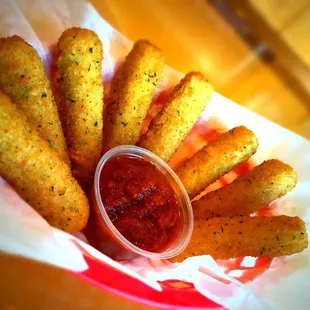 a bowl of ketchup and dipping sauce