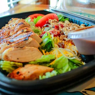a salad in a plastic container