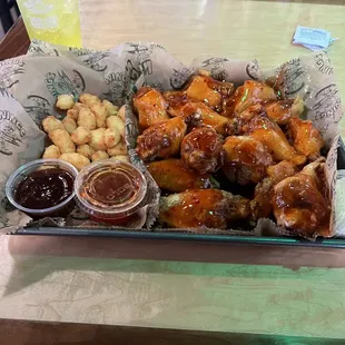 Cha Cha traditional chicken wings and cheese curds. Awesome!! A+