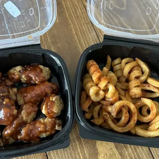 two containers of food on a table
