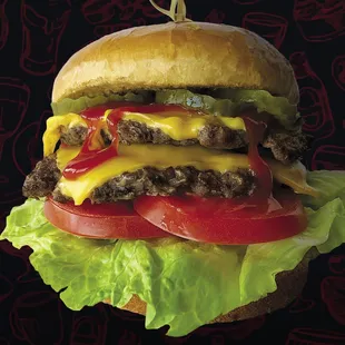 a cheeseburger with lettuce and tomato