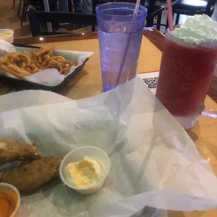 Curly fries and a Strawberry Daquari