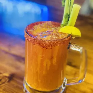 a bloody drink with celery garnish