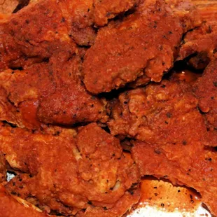 a pile of chicken wings