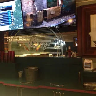 a view of the counter and tvs