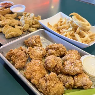 Our spread: Garlic Parmesan boneless chicken wings, cheesesteaks, fried pickle chips and curly fries.