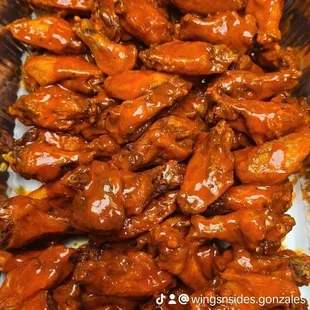 a closeup of a plate of chicken wings