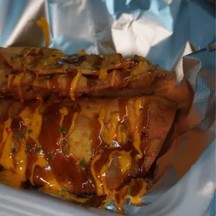Oxtail empanadas with the sauce on top
