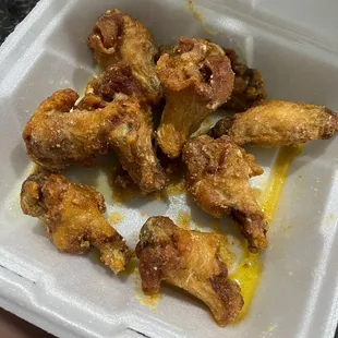 chicken wings in a styrofoam container