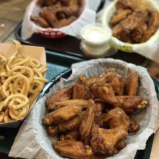 Top left: Teriyaki wings. Top right: medium wings. Bottom right: hot, honey, garlic wings