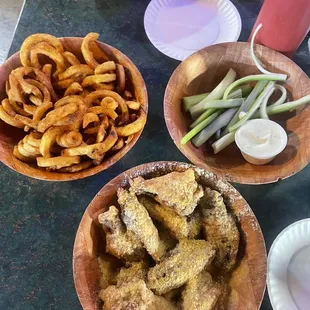 Cajun curly fries, Parmesan cheese medium heat wings and celery and ranch dressing