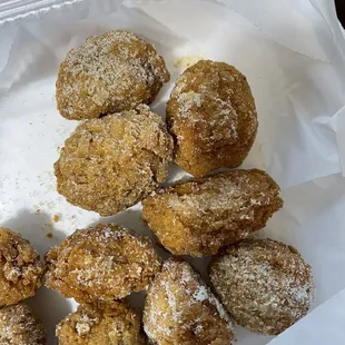a tray of fried doughnuts
