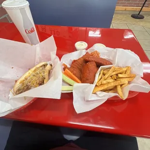 Chili Dog, Fries, 5-piece Chicken Tenders in Wings on Fire sauce