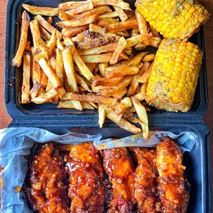 Tenders tossed in sweet chili sauce with wow fries and fried corn.. sheesh