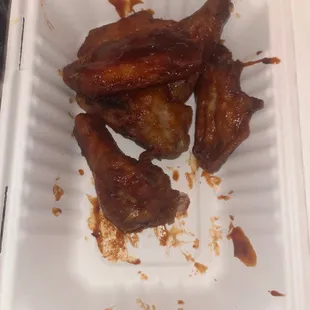 chicken wings in a styrofoam container