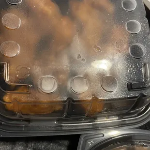 chicken wings in a plastic container