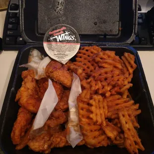 Red Alert boneless wings, Spicy Teriyaki boneless wings, and waffle fries.