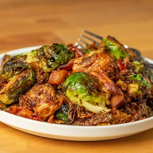 a plate of brussels sprouts and bacon