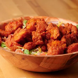 a wooden bowl of food