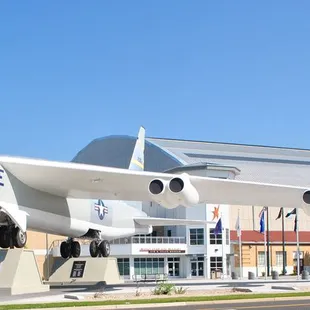 The front of Wings Over the Rockies Air &amp; Space Museum. It features a B-52 Stratofortess plane and aircraft hangar.