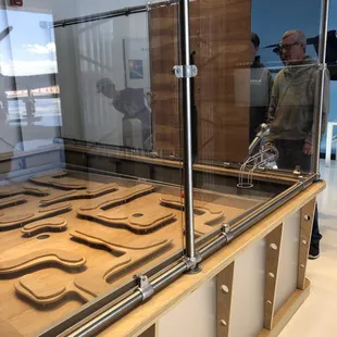 Cool activity. One person guides the pilot when they lose visibility- goal is to guide your ball through the maze without it falling early.