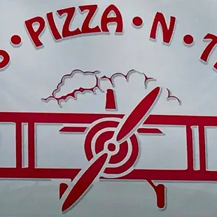 a sign for wings pizza n things