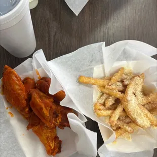 Buffalo wings and garlic Parmesan fries