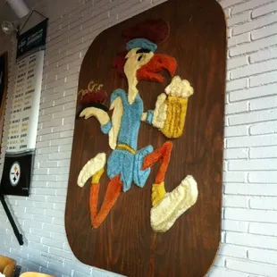 Their logo made out of carpet hanging on a wall. Awesome.