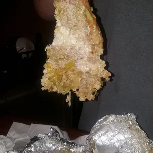 a person holding a piece of food