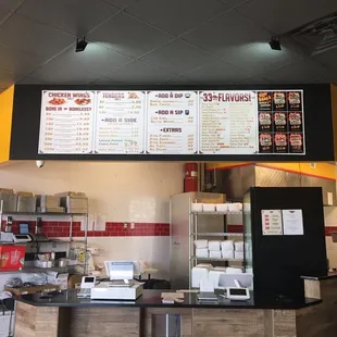 menus on the wall above the counter