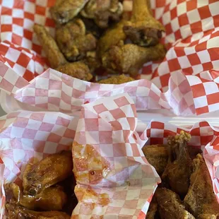 a basket of chicken wings and a basket of chicken wings