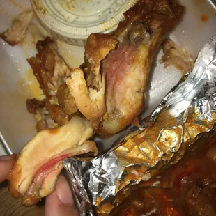 a person holding a plate of food